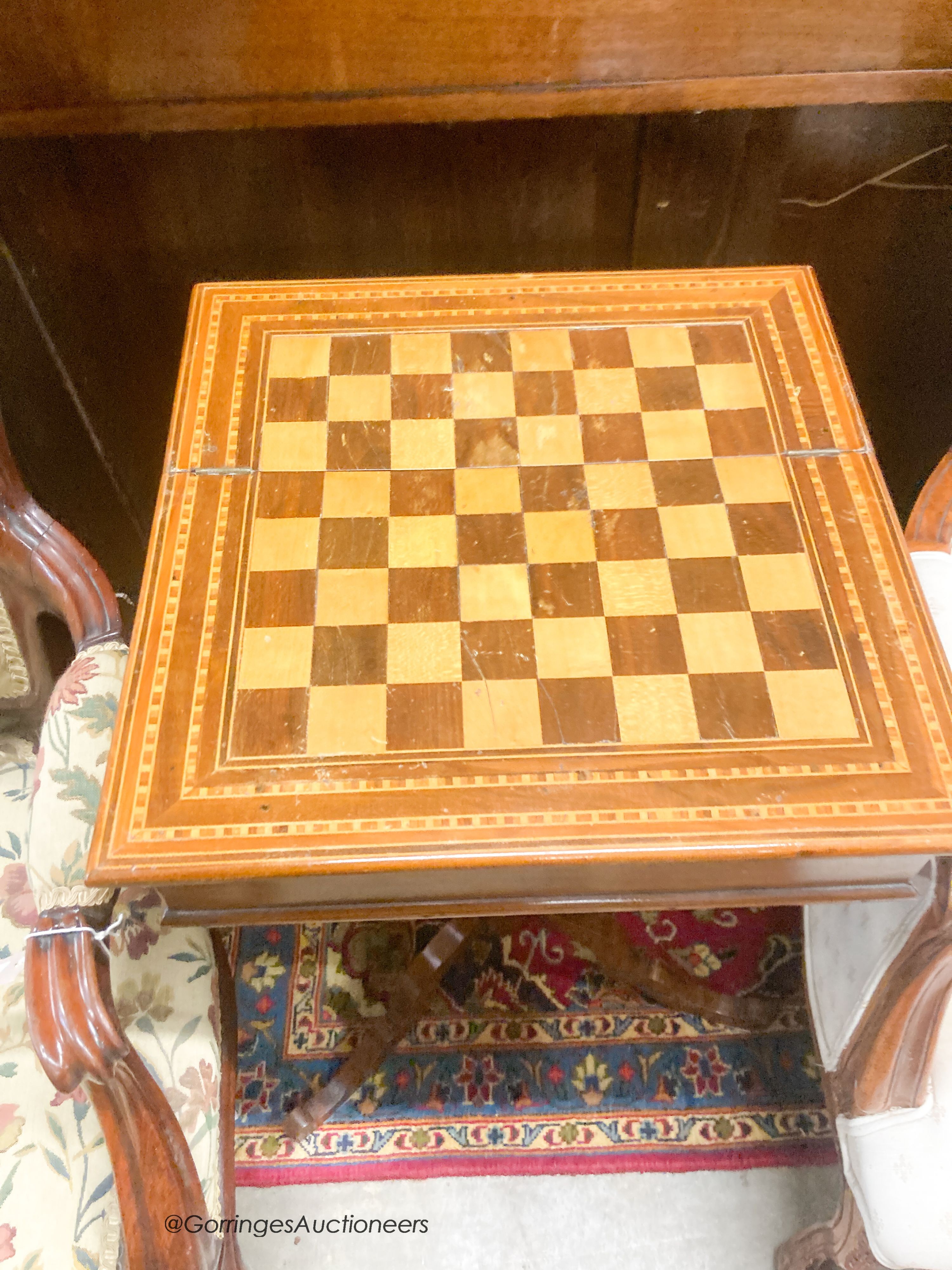 A mahogany games table, width 40cm, depth 40cm, height 74cm